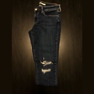 Levi’s 711 dark blue ripped jeans